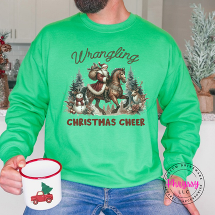 Wrangling Christmas Cheer crewneck sweatshirt in Irish Green featuring Santa on horseback.