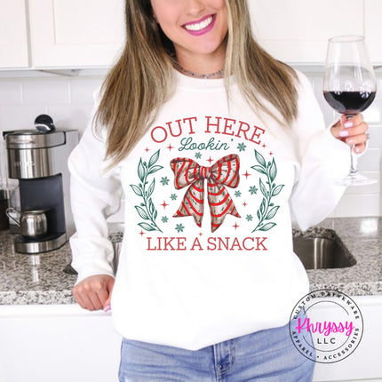 White crewneck sweatshirt with the Lookin Like A Snack candy cane bow.