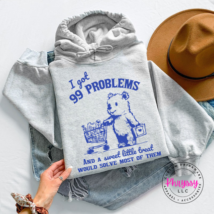 Model wearing the 99 Problems But a Sweet Little Treat treat bear hoodie in Ash.