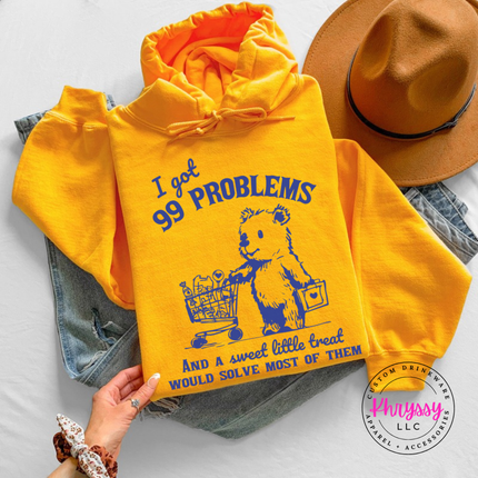 Close up of the treat bear art on a Gold hoodie.