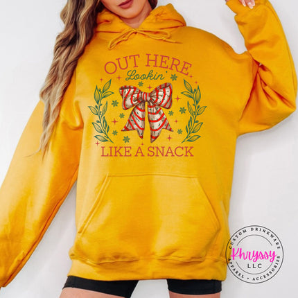Gold hoodie with the Lookin Like A Snack candy cane bow.