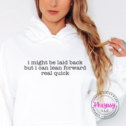 White hoodie with black typewriter quote about being laid back but leaning forward.