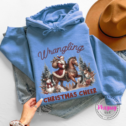 Wrangling Christmas Cheer hoodie in Carolina Blue featuring Santa on horseback.