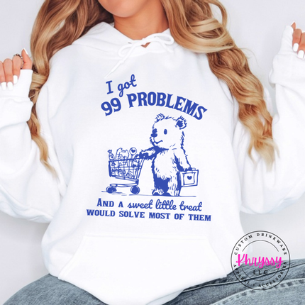 Model wearing the 99 Problems But a Sweet Little Treat treat bear hoodie in White.