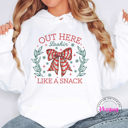 White hoodie with the Lookin Like A Snack candy cane bow.