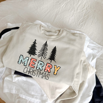 Flat lay of the Merry Christmas pine Christmas crewneck sweatshirt in Sand.