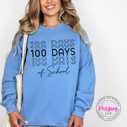 Carolina Blue Gildan crewneck with bold shadow repeat 100 Days of School typography.