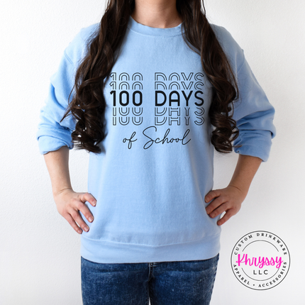 Light Blue Gildan crewneck showing bold stacked 100 Days of School repeat shadow print.