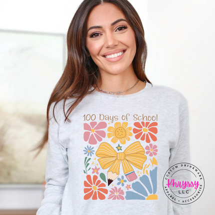 Gorgeous 100 days milestone long sleeve on ash Bella Canvas with warm golden bow and botanical graphic