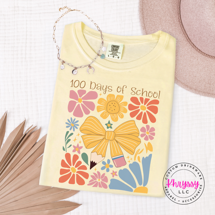 Bold 100 days floral celebration on butter Comfort Colors tee with pink gold and blue botanical bow print