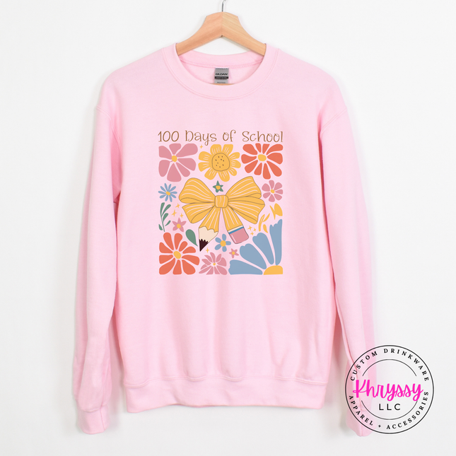 Bold 100 days floral celebration crewneck on Light pink Gildan with pink gold and blue botanical bow print