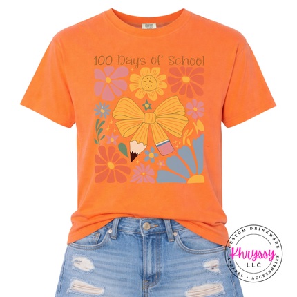 Vibrant floral bow 100 days milestone statement on Melon Comfort Colors tee with warm pink and gold flower print