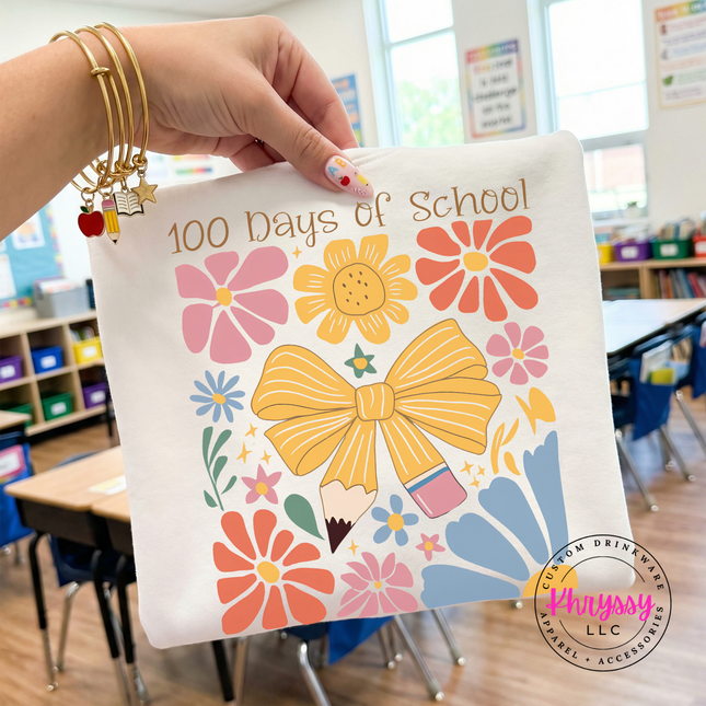 Rich 100 days of school floral bow statement on white Comfort Colors tee with warm botanical and golden bow graphic