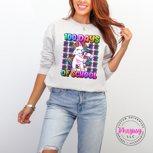 woman wearing an ash colored 100 Days Of School unicorn crewneck.