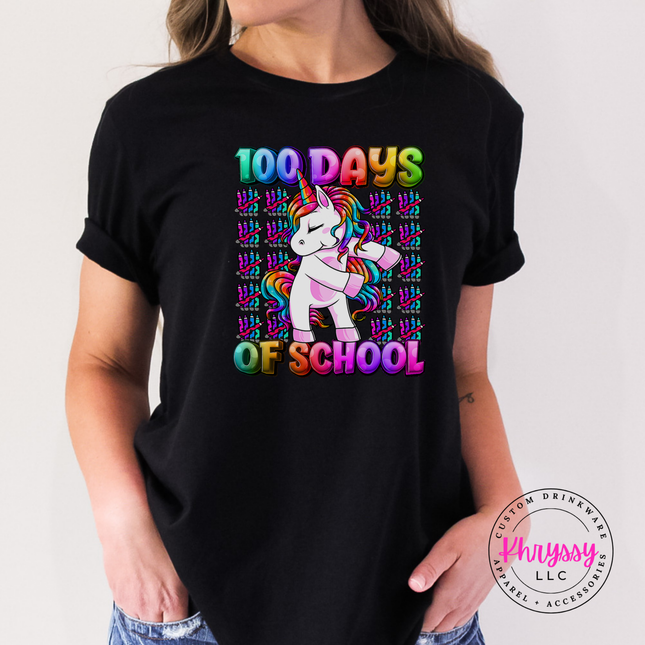 Woman wearing a black 100 Days Of School unicorn rainbow graphic tee.