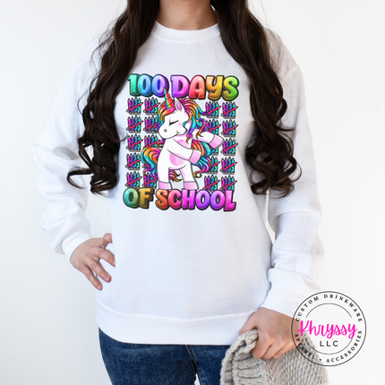 White unicorn rainbow 100 Days Of School crewneck with crayon accents.