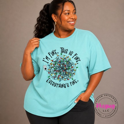 Woman wearing the I'm Fine This Is Fine Christmas tee in Chalky Mint.