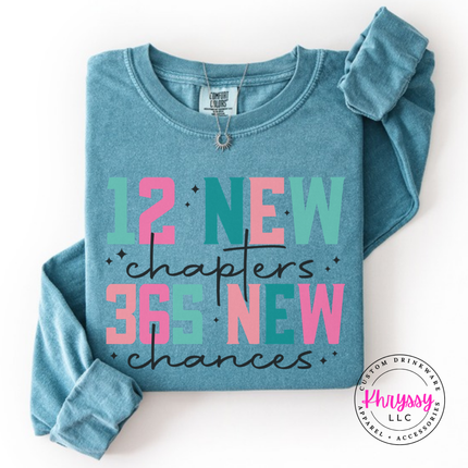 Flat lay of the New Year long sleeve tee in Ice Blue.