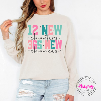Ivory long sleeve tee featuring 12 new chapters 365 new chances lettering.