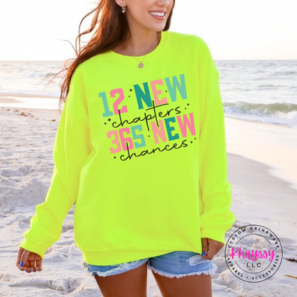 Safety Green crewneck sweatshirt featuring 12 new chapters 365 new chances lettering.