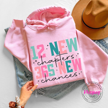 Flat lay of the New Year hoodie in Light Pink.