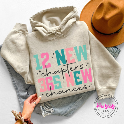 Close up of the New Year art on a Sand hoodie.