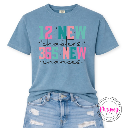 Flat lay of the New Year tee in Ice Blue.