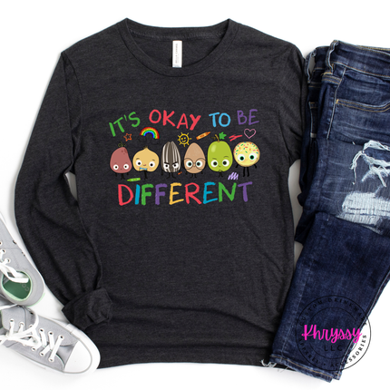 Bold colorful inclusion teacher statement on heather Black Bella Canvas long sleeve with vibrant rainbow character detail