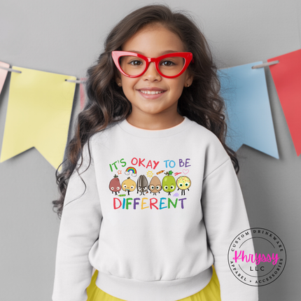 It’s okay to be different multicolor educator crewneck on white Gildan with bright classroom graphic