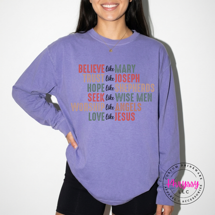 Close up of the Believe Like Mary art on a Violet long sleeve tee.