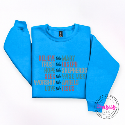Flat lay of the Believe Like Mary Christmas crewneck sweatshirt in Sapphire.