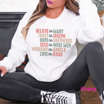 Model wearing the Believe Like Mary crewneck sweatshirt in White.