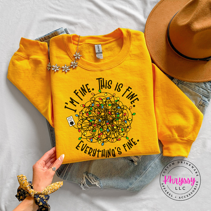 Woman wearing the I'm Fine This Is Fine Christmas crewneck sweatshirt in Gold.