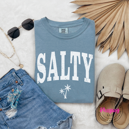 Ice Blue garment-dyed tee featuring a black SALTY beach print with a palm tree.