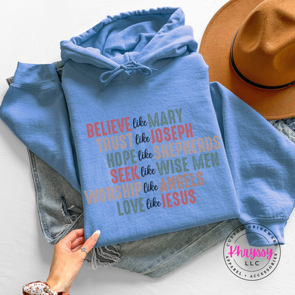 Close up of the Believe Like Mary art on a Carolina Blue hoodie.