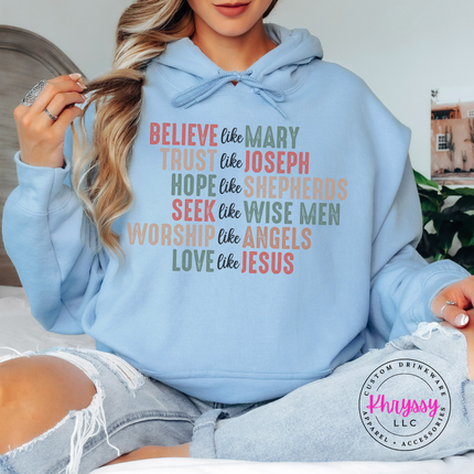 Light Blue hoodie showing six lines of Christian Christmas lettering.
