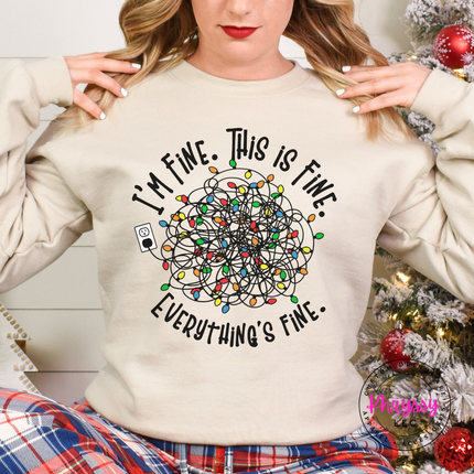Woman wearing the I'm Fine This Is Fine Christmas crewneck sweatshirt in Sand.