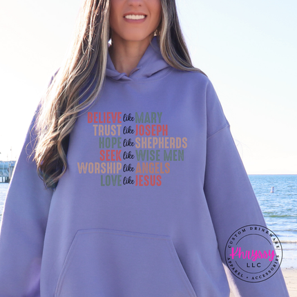 Close up of the Believe Like Mary art on a Violet hoodie.