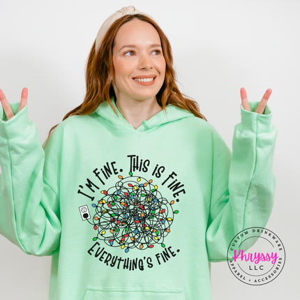 Mint Green hoodie with I'm Fine This Is Fine and tangled Christmas lights.