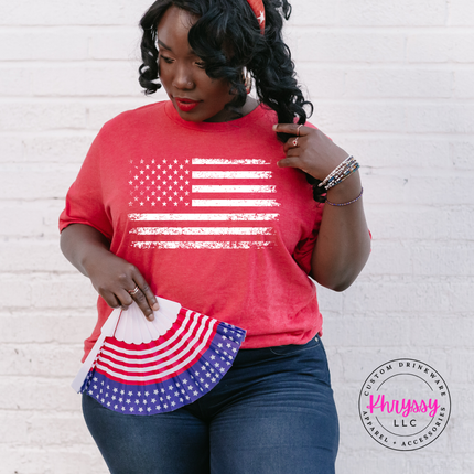 Red garment-dyed tee with a bold white vintage flag graphic across the chest.