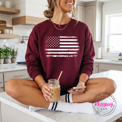 Maroon crewneck sweatshirt showing a distressed white American flag design.