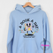 Light blue Gildan hoodie showing the multicolor retro book character and mental breakdown away text.