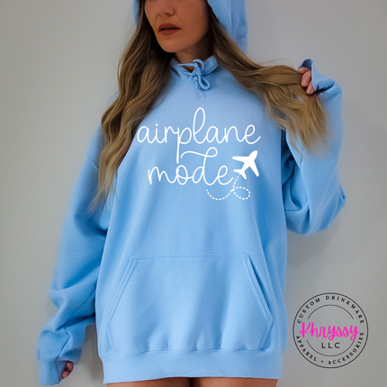 Light Blue pullover hoodie showing a black airplane mode script with a tiny plane.