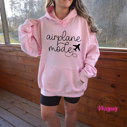 Light Pink pullover hoodie with a black airplane mode travel graphic on the chest.