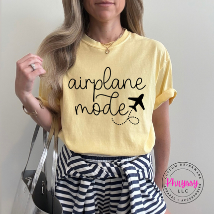 Butter garment-dyed tee with a black airplane mode script and airplane graphic.