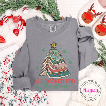 Gray long sleeve tee featuring a stacked book Christmas tree and All Booked For Christmas.