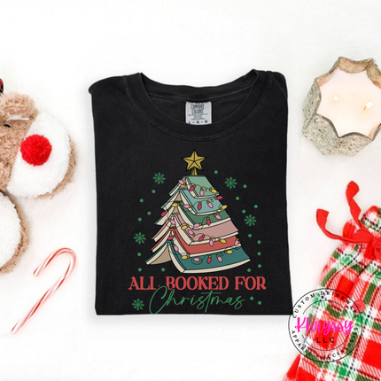 Black tee featuring a stacked book Christmas tree and All Booked For Christmas.