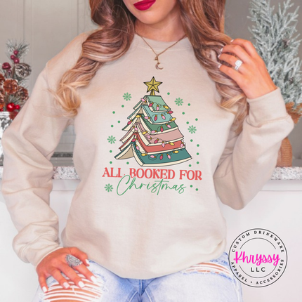 Close up of the book tree art on a Sand crewneck sweatshirt.