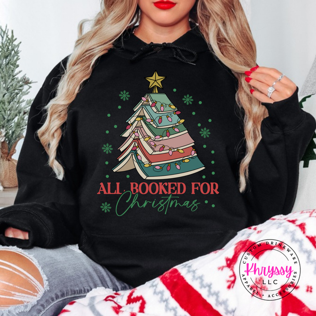 Black hoodie featuring a stacked book Christmas tree and All Booked For Christmas.