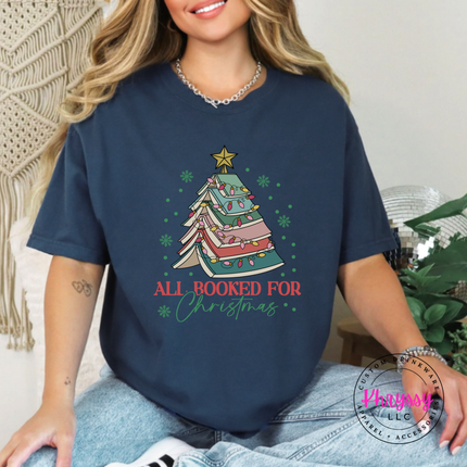 True Navy tee showing a tree of open books wrapped in Christmas lights.
